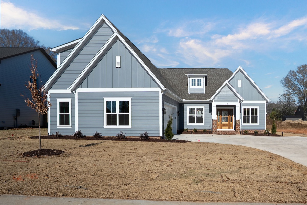 White farmhouse-style Trivium custom home exterior